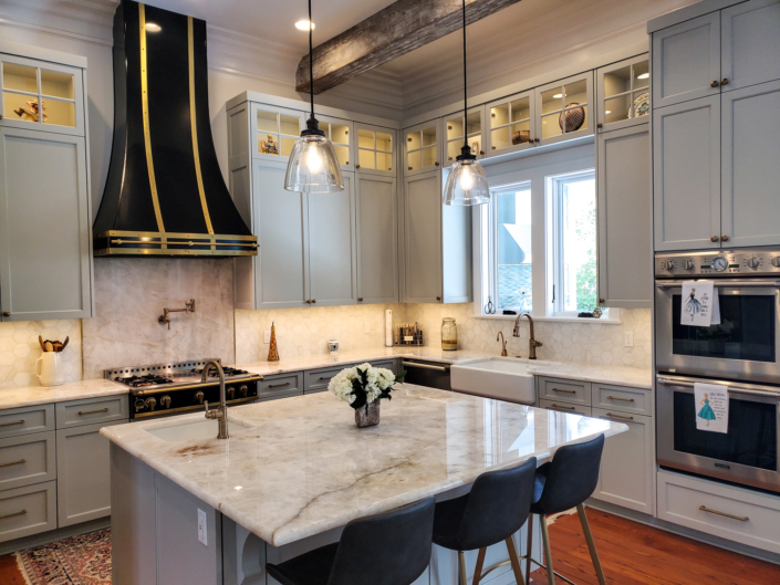 kitchen with island, counters, lighting, range hood, sink, window, counter tops | Stone Creations, Covington, LA
