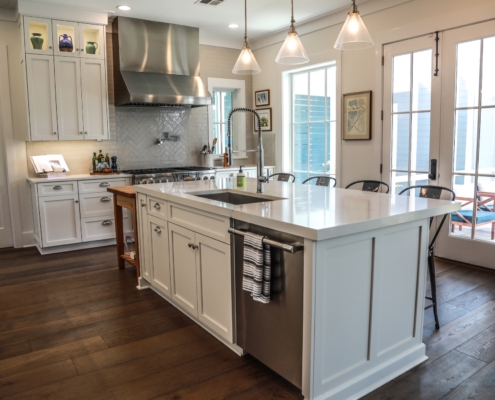 kitchen island, cabinets, sink, lighting, range hood, countertops | Stone Creations, Covington, LA